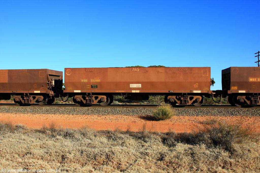 100731 02462
WOE type iron ore waggon WOE 33266 is one of a batch of thirty five built by Goninan WA between January and April 2005 with serial number 950104-006 and fleet number 765 for Koolyanobbing iron ore operations, on empty train 6418 at Binduli Triangle, 31st July 2010.
Keywords: WOE-type;WOE33266;Goninan-WA;950104-006;