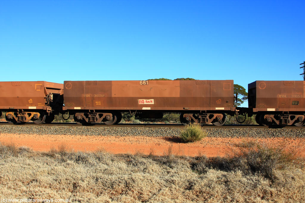 100731 02465
WOE type iron ore waggon WOE 31076 is one of a batch of one hundred and thirty built by Goninan WA between March and August 2001 with serial number 950092-066 and fleet number 661 for Koolyanobbing iron ore operations, on empty train 6418 at Binduli Triangle, 31st July 2010.
Keywords: WOE-type;WOE31076;Goninan-WA;950092-066;