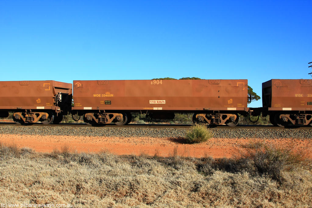 100731 02477
WOE type iron ore waggon WOE 33405 is one of a batch of one hundred and forty one built by United Group Rail WA between November 2005 and April 2006 with serial number 950142-110 and fleet number 8904 for Koolyanobbing iron ore operations, on empty train 6418 at Binduli Triangle, 31st July 2010.
Keywords: WOE-type;WOE33405;United-Group-Rail-WA;950142-110;