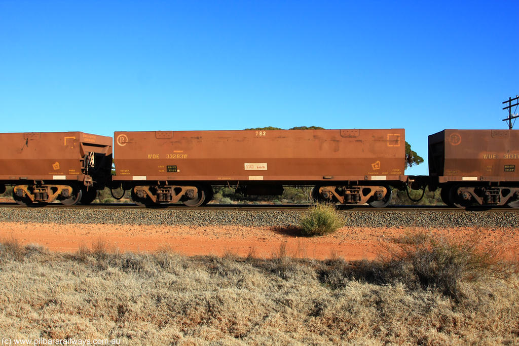 100731 02483
WOE type iron ore waggon WOE 33283 is one of a batch of thirty five built by United Goninan WA between January and April 2005 with serial number 950104-023 and fleet number 782 for Koolyanobbing iron ore operations, on empty train 6418 at Binduli Triangle, 31st July 2010.
Keywords: WOE-type;WOE33283;United-Goninan-WA;950104-023;