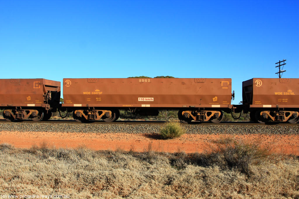 100731 02489
WOE type iron ore waggon WOE 33473 is one of a batch of one hundred and twenty eight built by United Group Rail WA between August 2008 and March 2009 with serial number 950211-015 and fleet number 8962 for Koolyanobbing iron ore operations, on empty train 6418 at Binduli Triangle, 31st July 2010.
Keywords: WOE-type;WOE33473;United-Group-Rail-WA;950211-015;
