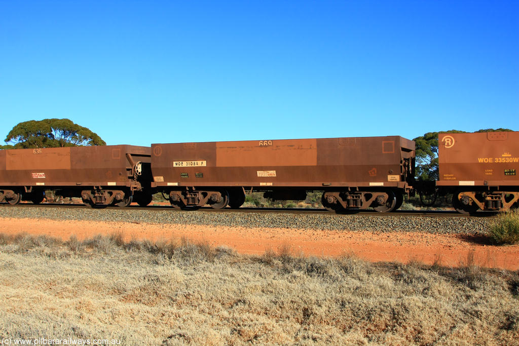 100731 02500
WOE type iron ore waggon WOE 31084 is one of a batch of one hundred and thirty built by Goninan WA between March and August 2001 with serial number 950092-074 and fleet number 669 for Koolyanobbing iron ore operations, on empty train 6418 at Binduli Triangle, 31st July 2010.
Keywords: WOE-type;WOE31084;Goninan-WA;950092-074;