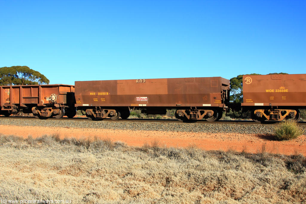 100731 02522
WOE type iron ore waggon WOE 30252 is one of a batch of one hundred and thirty built by Goninan WA between March and August 2001 with serial number 950092-002 and fleet number 602 for Koolyanobbing iron ore operations with a built date April 2001 in the current style of 83 tonne load capacity WOE type waggon built for Portman Mining on Koolyanobbing iron ore train service, on empty train 6418 at Binduli Triangle, 31st July 2010.
Keywords: WOE-type;WOE30252;Goninan-WA;950092-002;
