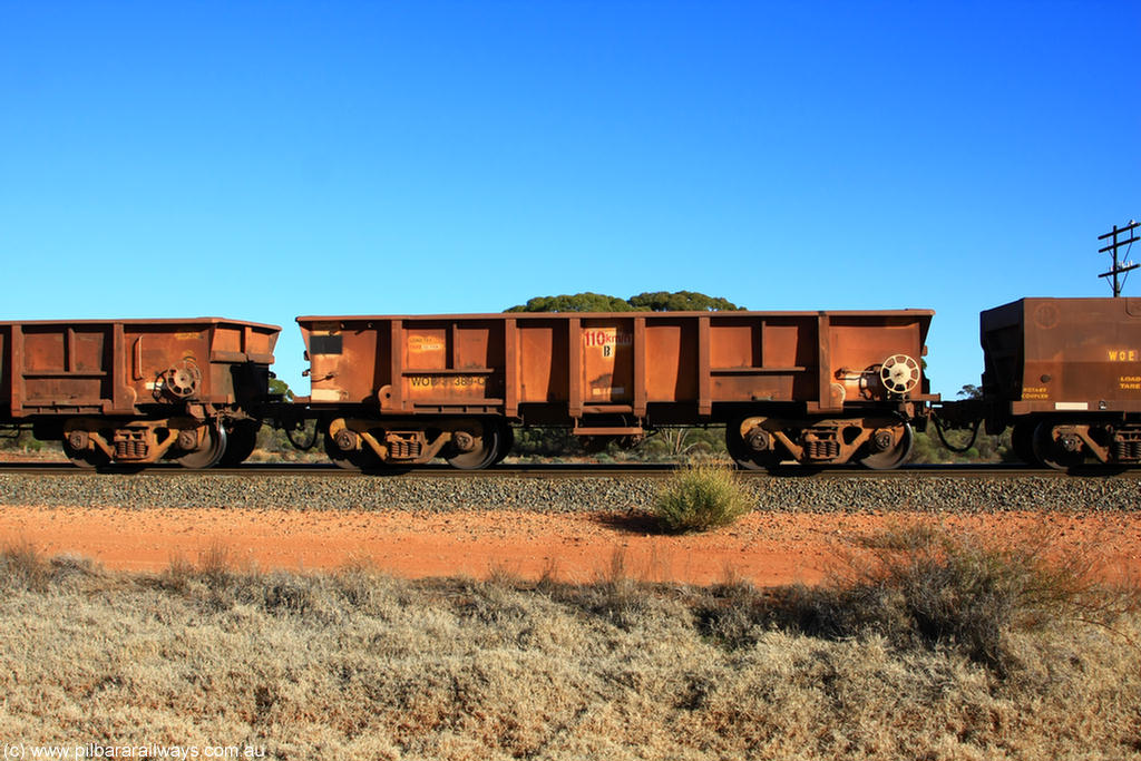 100731 02523
WOB type iron ore waggon WOB 31389 is one of a batch of twenty five built by Comeng WA between 1974 and 1975 and converted from Mt Newman high sided waggons by WAGR Midland Workshops with a capacity of 67 tons with fleet number 314 for Koolyanobbing iron ore operations. This waggon was also converted to a WSM type ballast hopper by re-fitting the cut down top section and having bottom discharge doors fitted, converted back to WOB in 1998, on empty train 6418 at Binduli Triangle, 31st July 2010.
Keywords: WOB-type;WOB31389;Comeng-WA;WSM-type;Mt-Newman-Mining;