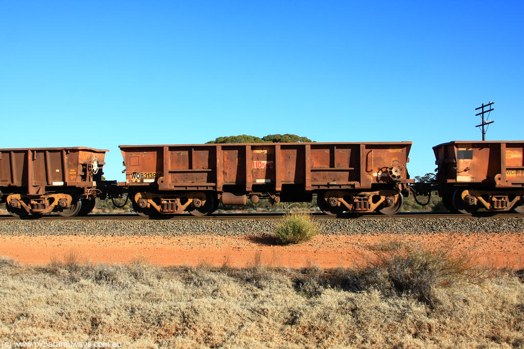100731 02524
WOB type iron ore waggon WOB 31381 is one of a batch of twenty five built by Comeng WA between 1974 and 1975 and converted from Mt Newman high sided waggons by WAGR Midland Workshops with a capacity of 67 tons with fleet number 306 for Koolyanobbing iron ore operations, on empty train 6418 at Binduli Triangle, 31st July 2010.
Keywords: WOB-type;WOB31381;Comeng-WA;Mt-Newman-Mining;