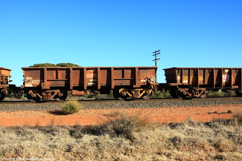 100731 02533
WOB type iron ore waggon WOB 31384 is one of a batch of twenty five built by Comeng WA between 1974 and 1975 and converted from Mt Newman high sided waggons by WAGR Midland Workshops with a capacity of 67 tons with fleet number 309 for Koolyanobbing iron ore operations, on empty train 6418 at Binduli Triangle, 31st July 2010.
Keywords: WOB-type;WOB31384;Comeng-WA;Mt-Newman-Mining;