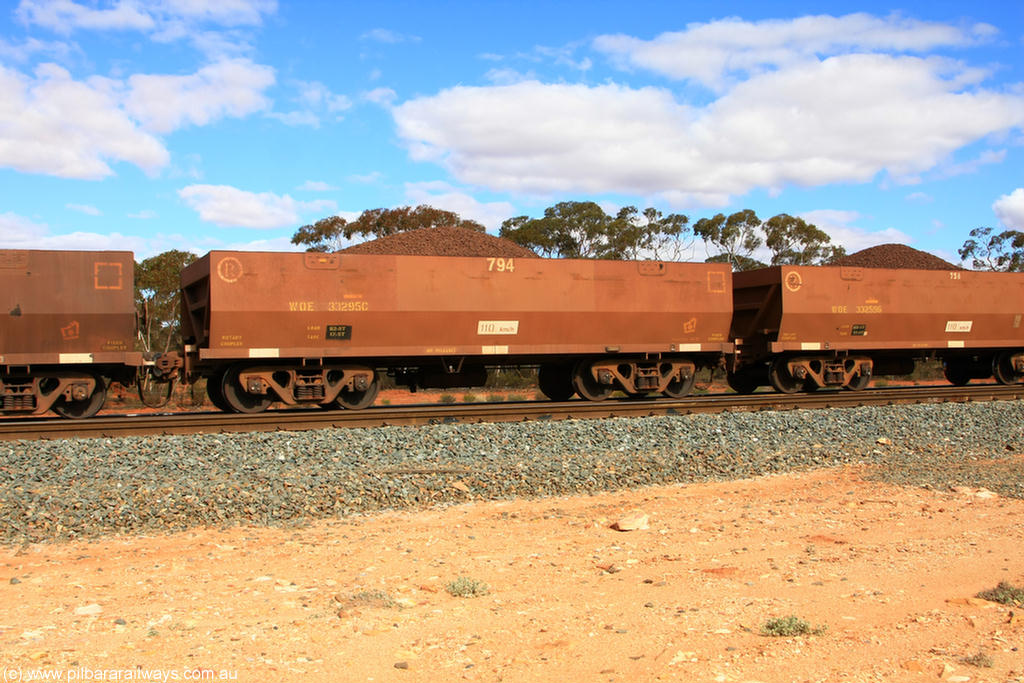 100731 02826
WOE type iron ore waggon WOE 33295 is the final one of a batch of thirty five built by United Goninan WA between January and April 2005 with serial number 950104-035 and fleet number 794 for Koolyanobbing iron ore operations, on loaded train 7415 at Binduli Triangle, 31st July 2010.
Keywords: WOE-type;WOE33295;United-Goninan-WA;950104-035;
