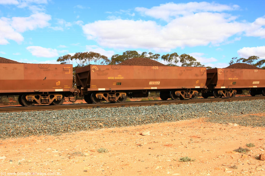 100731 02833
WOE type iron ore waggon WOE 33429 is one of a batch of one hundred and forty one built by United Group Rail WA between November 2005 and April 2006 with serial number 950142-134 and fleet number 8928 for Koolyanobbing iron ore operations, on loaded train 7415 at Binduli Triangle, 31st July 2010.
Keywords: WOE-type;WOE33429;United-Group-Rail-WA;950142-134;