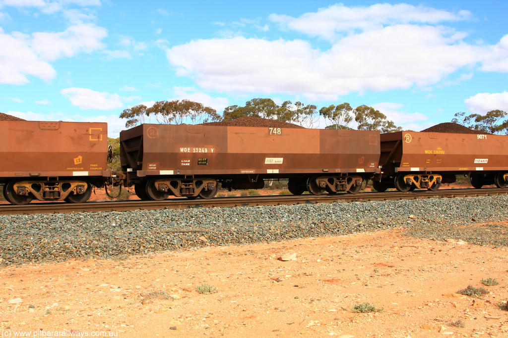 100731 02840
WOE type iron ore waggon WOE 33249 is one of a batch of twenty seven built by Goninan WA between September and October 2002 with serial number 950103-016 and fleet number 748 for Koolyanobbing iron ore operations, on loaded train 7415 at Binduli Triangle, 31st July 2010.
Keywords: WOE-type;WOE33249;Goninan-WA;950103-016;