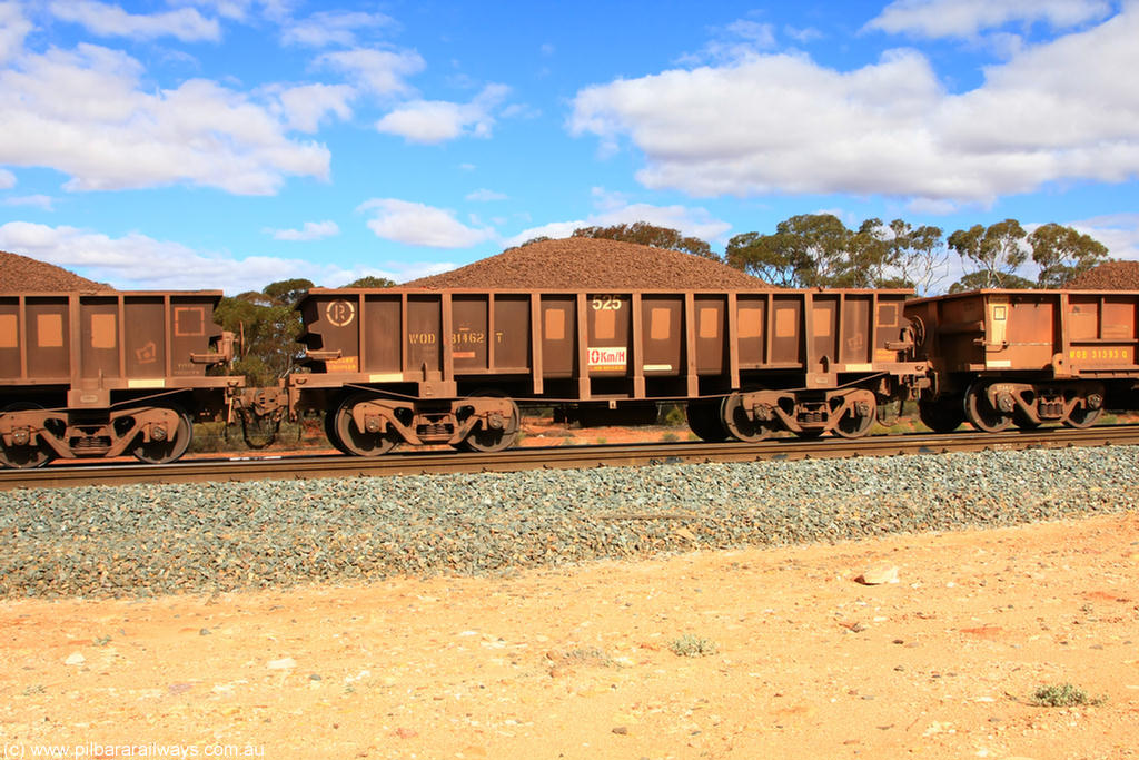 100731 02879
WOD type iron ore waggon WOD 31462 is one of a batch of sixty two built by Goninan WA between April and August 2000 with serial number 950086-034 and fleet number 525 for Koolyanobbing iron ore operations with a 75 ton capacity for Portman Mining to cart their Koolyanobbing iron ore to Esperance, now with PORTMAN painted out, on loaded train 7415 at Binduli Triangle, 31st July 2010.
Keywords: WOD-type;WOD31462;Goninan-WA;950086-034;
