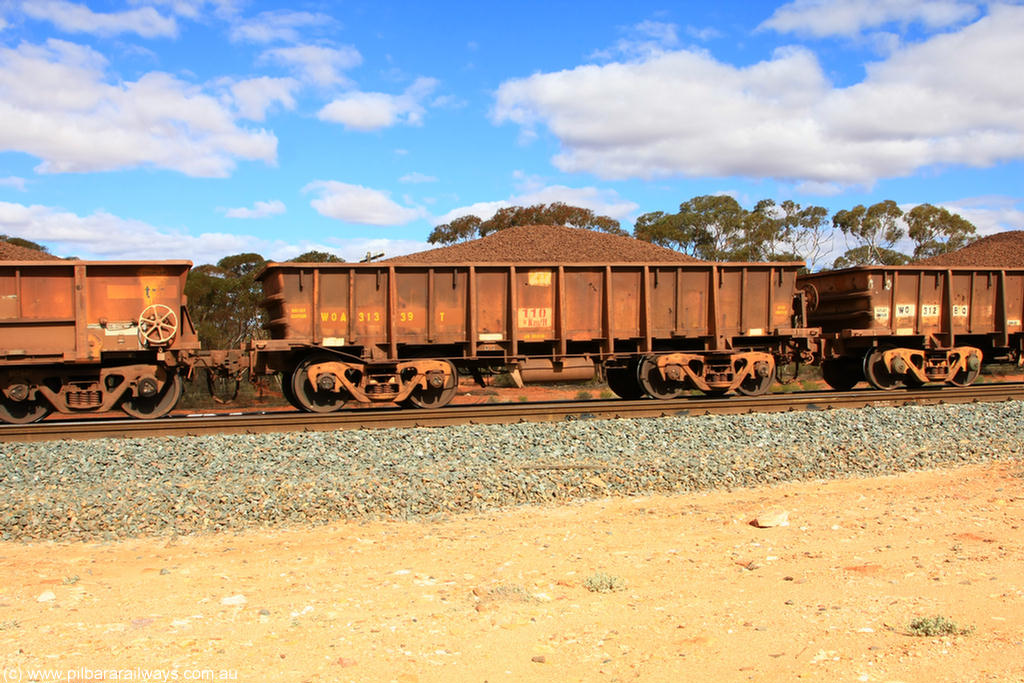 100731 02881
WOA type iron ore waggon WOA 31339 is one of a batch of thirty nine built by WAGR Midland Workshops between 1970 and 1971 with fleet number 217 for Koolyanobbing iron ore operations, with a 75 ton and 1018 ft³ capacity, on loaded train 7415 at Binduli Triangle, 31st July 2010.
Keywords: WOA-type;WOA31339;WAGR-Midland-WS;