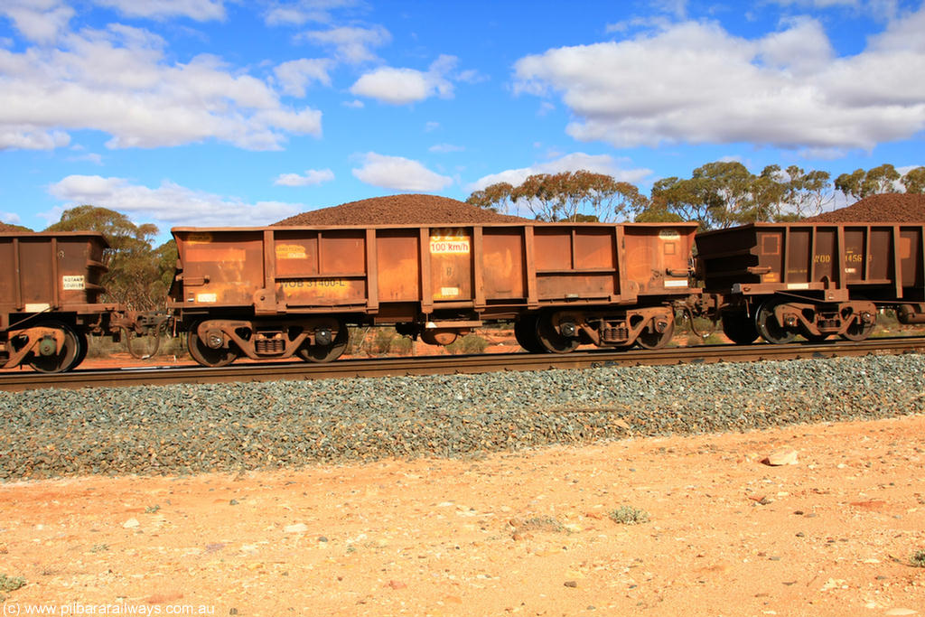 100731 02894
WOB type iron ore waggon WOB 31400 is one of a batch of twenty five built by Comeng WA between 1974 and 1975 and converted from Mt Newman high sided waggons by WAGR Midland Workshops with a capacity of 67 tons with fleet number 324 for Koolyanobbing iron ore operations. This waggon was also converted to a WSM type ballast hopper by re-fitting the cut down top section and having bottom discharge doors fitted, converted back to WOB in 1998, on loaded train 7415 at Binduli Triangle, 31st July 2010.
Keywords: WOB-type;WOB31400;Comeng-WA;WSM-type;Mt-Newman-Mining;
