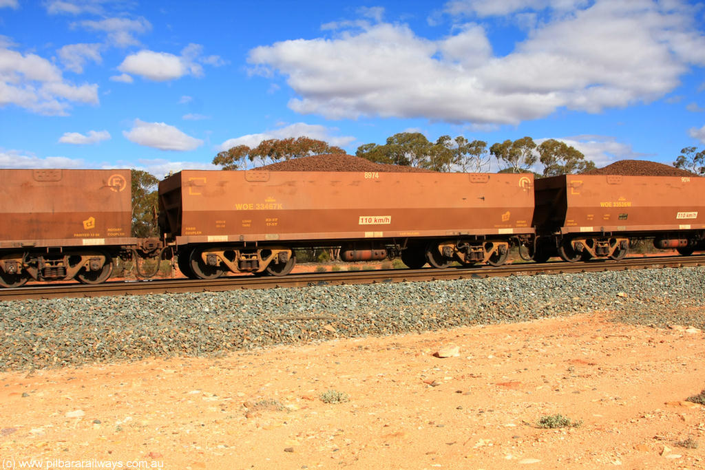 100731 02903
WOE type iron ore waggon WOE 33467 is one of a batch of one hundred and twenty eight built by United Group Rail WA between August 2008 and March 2009 with serial number 950211-009 and fleet number 8974 for Koolyanobbing iron ore operations, on loaded train 7415 at Binduli Triangle, 31st July 2010.
Keywords: WOE-type;WOE33467;United-Group-Rail-WA;950211-009;