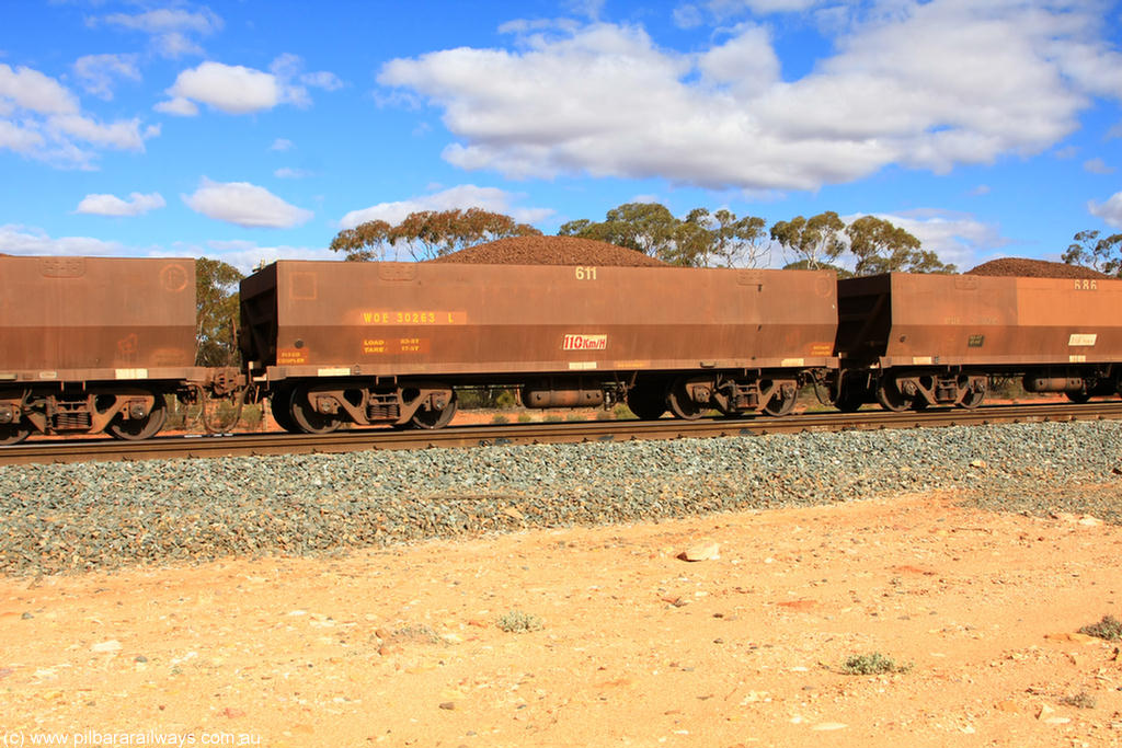 100731 02912
WOE type iron ore waggon WOE 30263 is one of a batch of one hundred and thirty built by Goninan WA between March and August 2001 with serial number 950092-013 and fleet number 611 for Koolyanobbing iron ore operations, on loaded train 7415 at Binduli Triangle, 31st July 2010.
Keywords: WOE-type;WOE30263;Goninan-WA;950092-013;