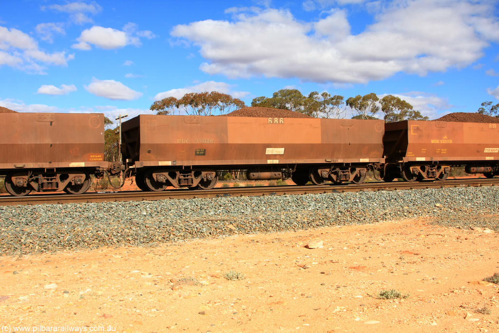 100731 02913
WOE type iron ore waggon WOE 31102 is one of a batch of one hundred and thirty built by Goninan WA between March and August 2001 with serial number 950092-092 and fleet number 686 for Koolyanobbing iron ore operations, on loaded train 7415 at Binduli Triangle, 31st July 2010.
Keywords: WOE-type;WOE31102;Goninan-WA;950092-092;