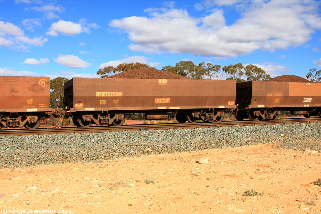100731 02915
WOE type iron ore waggon WOE 31073 is one of a batch of one hundred and thirty built by Goninan WA between March and August 2001 with serial number 950092-063 and fleet number 659 for Koolyanobbing iron ore operations, on loaded train 7415 at Binduli Triangle, 31st July 2010.
Keywords: WOE-type;WOE31073;Goninan-WA;950092-063;