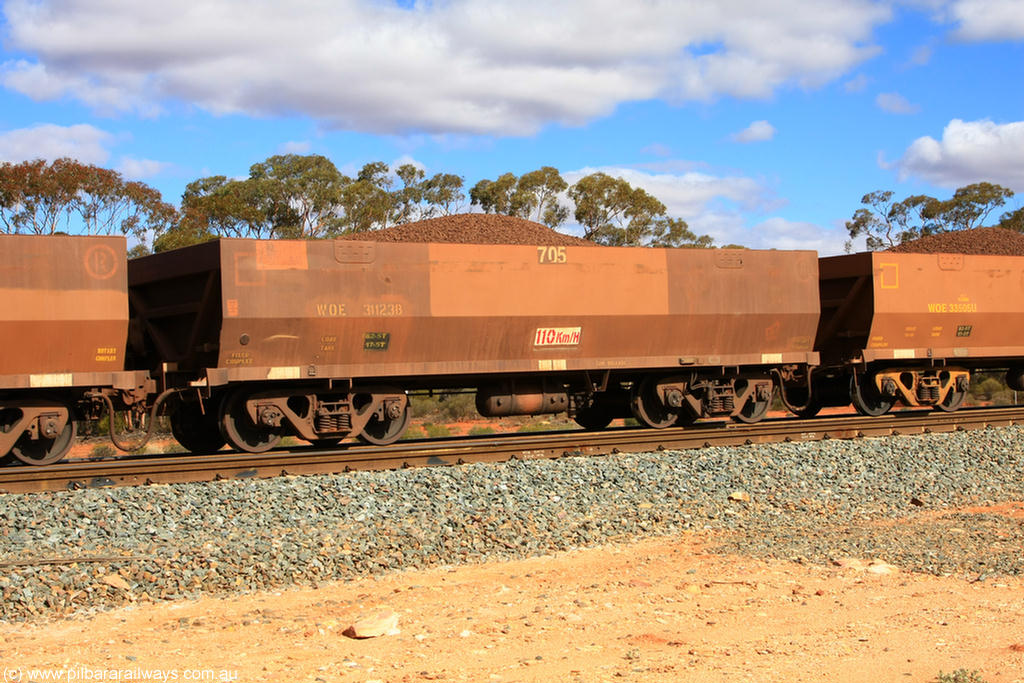 100731 02929
WOE type iron ore waggon WOE 31123 is one of a batch of one hundred and thirty built by Goninan WA between March and August 2001 with serial number 950092-113 and fleet number 705 for Koolyanobbing iron ore operations, on loaded train 7415 at Binduli Triangle, 31st July 2010.
Keywords: WOE-type;WOE31123;Goninan-WA;950092-113;