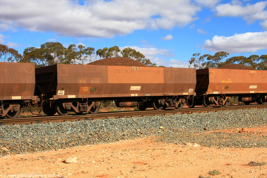 100731 02933
WOE type iron ore waggon WOE 31121 is one of a batch of one hundred and thirty built by Goninan WA between March and August 2001 with serial number 950092-111 and fleet number 703 for Koolyanobbing iron ore operations, on loaded train 7415 at Binduli Triangle, 31st July 2010.
Keywords: WOE-type;WOE31121;Goninan-WA;950092-111;