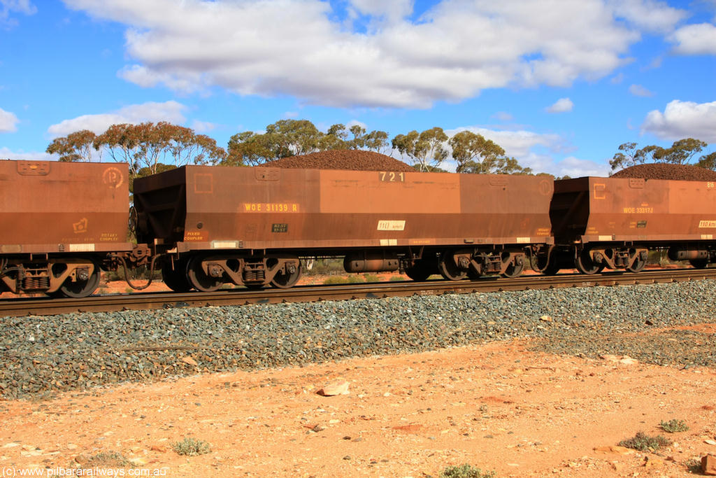 100731 02936
WOE type iron ore waggon WOE 31139 is one of a batch of one hundred and thirty built by Goninan WA between March and August 2001 with serial number 950092-129 and fleet number 721 for Koolyanobbing iron ore operations, on loaded train 7415 at Binduli Triangle, 31st July 2010.
Keywords: WOE-type;WOE31139;Goninan-WA;950092-129;