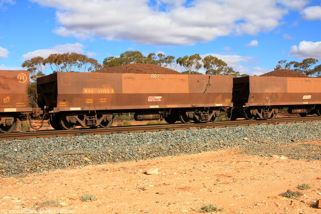 100731 02938
WOE type iron ore waggon WOE 31109 is one of a batch of one hundred and thirty built by Goninan WA between March and August 2001 with serial number 950092-099 and fleet number 692 for Koolyanobbing iron ore operations, on loaded train 7415 at Binduli Triangle, 31st July 2010.
Keywords: WOE-type;WOE31109;Goninan-WA;950092-099;