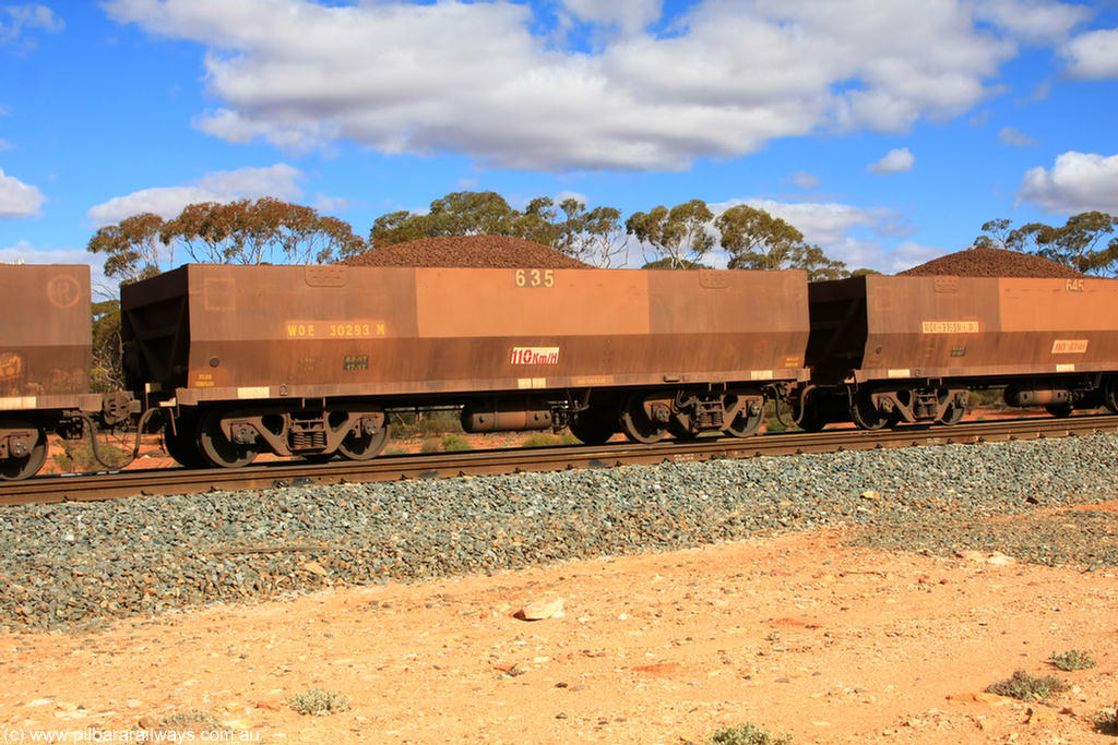 100731 02940
WOE type iron ore waggon WOE 30293 is one of a batch of one hundred and thirty built by Goninan WA between March and August 2001 with serial number 950092-043 and fleet number 635 for Koolyanobbing iron ore operations, on loaded train 7415 at Binduli Triangle, 31st July 2010.
Keywords: WOE-type;WOE30293;Goninan-WA;950092-043;