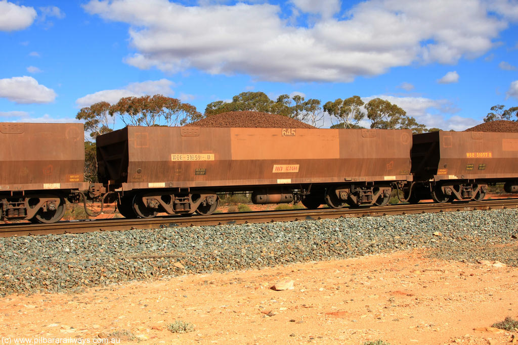 100731 02941
WOE type iron ore waggon WOE 31059 is one of a batch of fifteen built by Goninan WA between April and May 2002 with fleet number 645 for Koolyanobbing iron ore operations, on loaded train 7415 at Binduli Triangle, 31st July 2010.
Keywords: WOE-type;WOE31059;Goninan-WA;