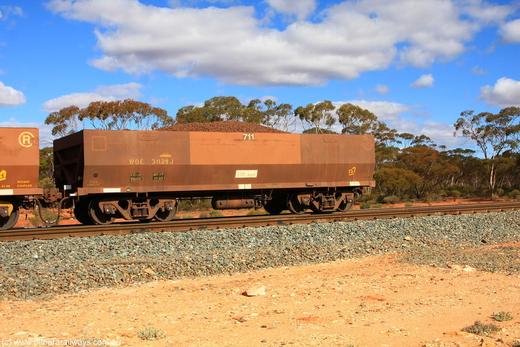 100731 02948
WOE type iron ore waggon WOE 31129 is one of a batch of one hundred and thirty built by Goninan WA between March and August 2001 with serial number 950092-119 and fleet number 711 for Koolyanobbing iron ore operations, on loaded train 7415 at Binduli Triangle, 31st July 2010.
Keywords: WOE-type;WOE31129;Goninan-WA;950092-119;