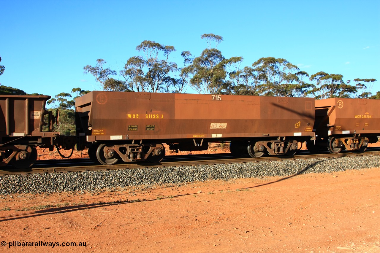 100731 03057
WOE type iron ore waggon WOE 31133 is one of a batch of one hundred and thirty built by Goninan WA between March and August 2001 with serial number 950092-123 and fleet number 715 for Koolyanobbing iron ore operations with PORTMAN painted out and a revised load of 82.5 tonnes, empty train arriving at Binduli Triangle, 31st July 2010.
Keywords: WOE-type;WOE31133;Goninan-WA;950092-123;