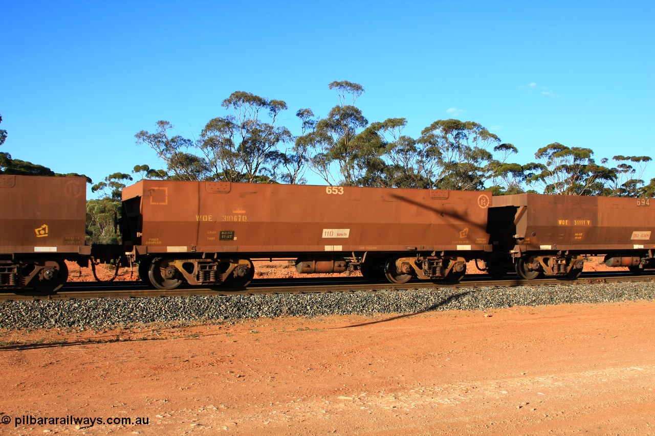 100731 03127
WOE type iron ore waggon WOE 31067 is one of a batch of one hundred and thirty built by Goninan WA between March and August 2001 with serial number 950092-057 and fleet number 653 for Koolyanobbing iron ore operations, empty train arriving at Binduli Triangle, 31st July 2010.
Keywords: WOE-type;WOE31067;Goninan-WA;950092-057;