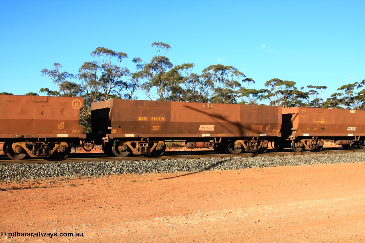 100731 03128
WOE type iron ore waggon WOE 31111 is one of a batch of one hundred and thirty built by Goninan WA between March and August 2001 with serial number 950092-101 and fleet number 694 for Koolyanobbing iron ore operations, empty train arriving at Binduli Triangle, 31st July 2010.
Keywords: WOE-type;WOE31111;Goninan-WA;950092-101;