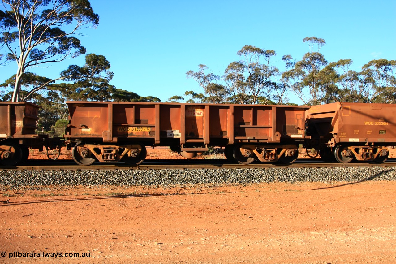 100731 03141
WOB type iron ore waggon WOB 31399 is one of a batch of twenty five built by Comeng WA between 1974 and 1975 and converted from Mt Newman high sided waggons by WAGR Midland Workshops with a capacity of 67 tons with fleet number 323 for Koolyanobbing iron ore operations, empty train arriving at Binduli Triangle, 31st July 2010.
Keywords: WOB-type;WOB31399;Comeng-WA;WSM-type;Mt-Newman-Mining;