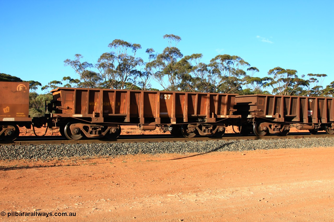 100731 03146
WOC type iron ore waggon WOC 31367 is one of a batch of thirty built by Goninan WA between October 1997 to January 1998 with fleet number 427 for Koolyanobbing iron ore operations with a 75 ton capacity and lettered for KIPL, Koolyanobbing Iron Pty Ltd, with the IP painted over, empty train arriving at Binduli Triangle, 31st July 2010.
Keywords: WOC-type;WOC31367;Goninan-WA;