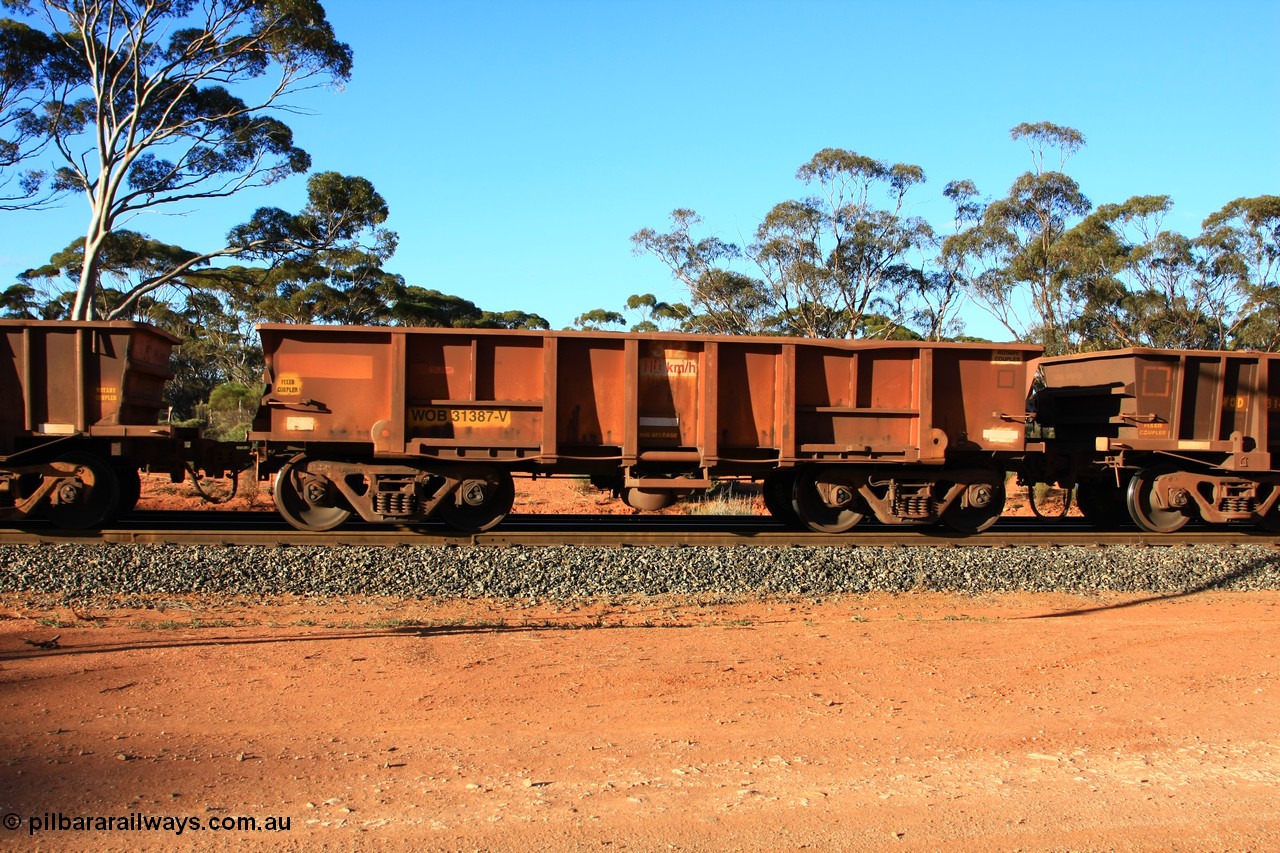 100731 03175
WOB type iron ore waggon WOB 31387 is one of a batch of twenty five built by Comeng WA between 1974 and 1975 and converted from Mt Newman high sided waggons by WAGR Midland Workshops with a capacity of 67 tons with fleet number 312 for Koolyanobbing iron ore operations. This waggon was also converted to a WSM type ballast hopper by re-fitting the cut down top section and having bottom discharge doors fitted, converted back to WOB in 1998, empty train arriving at Binduli Triangle, 31st July 2010.
Keywords: WOB-type;WOB31387;Comeng-WA;WSM-type;Mt-Newman-Mining;