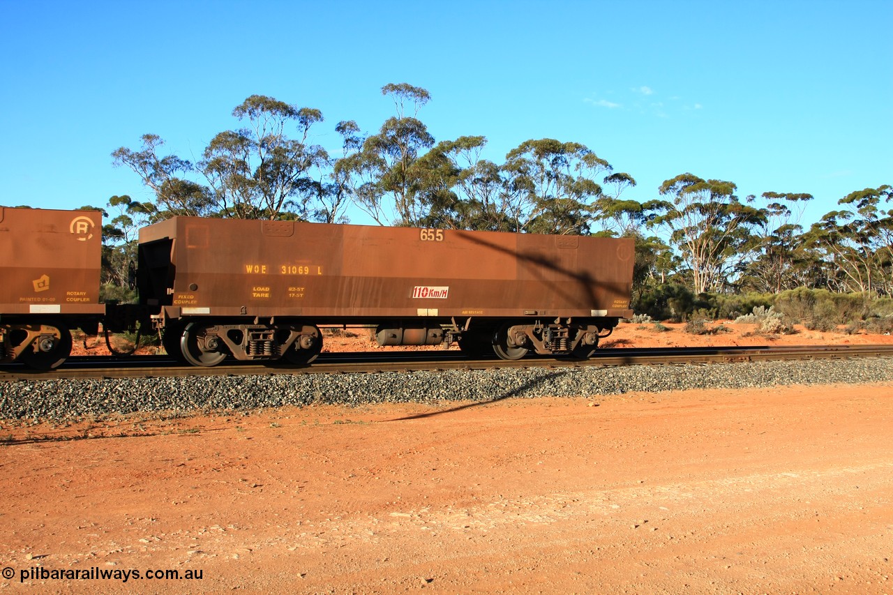 100731 03181
WOE type iron ore waggon WOE 31069 is one of a batch of one hundred and thirty built by Goninan WA between March and August 2001 with serial number 950092-059 and fleet number 655 for Koolyanobbing iron ore operations, with PORTMAN painted out and the load revised down to 72.5 tonnes, empty train arriving at Binduli Triangle, 31st July 2010.
Keywords: WOE-type;WOE31069;Goninan-WA;950092-059;
