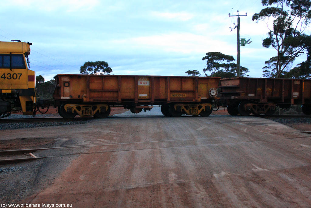 100822 6204
WOB type iron ore waggon WOB 31395 is one of a batch of twenty five built by Comeng WA between 1974 and 1975 and converted from Mt Newman high sided waggons by WAGR Midland Workshops with a capacity of 67 tons with fleet number 325 for Koolyanobbing iron ore operations. This waggon was also converted to a WSM type ballast hopper by re-fitting the cut down top section and having bottom discharge doors fitted, converted back to WOB in 1997, in ARG yellow, on empty train 1416 at Hampton, 22nd August 2010.
Keywords: WOB-type;WOB31395;Comeng-WA;WSM-type;Mt-Newman-Mining;