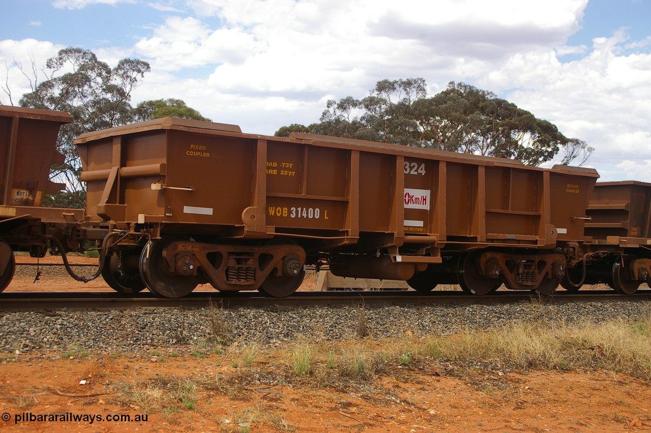 PD 12415
Binduli, WOB type iron ore waggon WOB 31400 is one of a batch of twenty five built by Comeng WA between 1974 and 1975 and converted from Mt Newman high sided waggons by WAGR Midland Workshops with a capacity of 67 tons with fleet number 324 for Koolyanobbing iron ore operations, but purchased by WAGR. This waggon is one of the 15 converted to WSM type ballast hoppers by re-fitting the removed top section of the body and fitting bottom discharge doors, converted back to WOB in 1998, and shows signs of heavy re-sheeting and full repainting.
Keywords: Peter-D-Image;WOB-type;WOB31400;Comeng-WA;WSM-type;Mt-Newman-Mining;