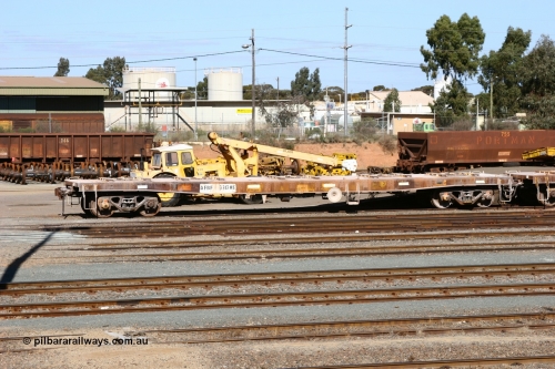 060528 4439
West Kalgoorlie, looking across to the waggon repair facility, in the foreground is flat waggon AFBF 33178 modified for kibble service originally built by WAGR Midland Workshops in 1970 as a WGX type open waggon, but behind is red carded WO type waggon WO 31286 with fleet number 166 and WOE type WOE 33256 with fleet number 755. May 28, 2006.
Keywords: AFBF-type;AFBF33178;WAGR-Midland-WS;WGX-type;WGG-type;WOSF-type;