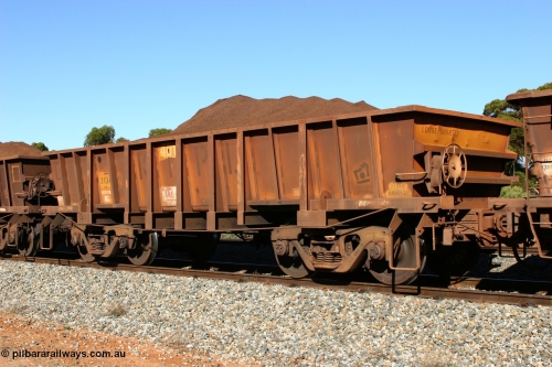 060528 4567
WOC type iron ore waggon WOC 31341 is leader of a batch of thirty built by Goninan WA between October 1997 to January 1998 with fleet number 401 for Koolyanobbing iron ore operations with a 75 ton capacity and lettered for KIPL, Koolyanobbing Iron Pty Ltd, seen here loaded with fines ore at Bonnie Vale in train number 413, May 28, 2006.
Keywords: WOC-type;WOC31341;Goninan-WA;