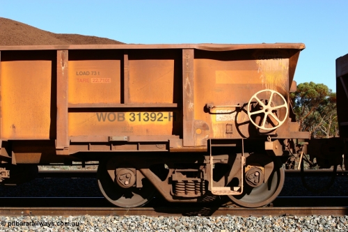 060528 4585
WOB type iron ore waggon WOB 31392 is one of a batch of twenty five built by Comeng WA between 1974 and 1975 and converted from Mt Newman high sided waggons by WAGR Midland Workshops with fleet number 317 for Koolyanobbing iron ore operations, shows the higher tare of these waggons and the capacity of 73 tons, waggon length of 10.8 metres, and a close inspection reveals that the round WAGR waggon builder's number is 31391 of 1974, this waggon cut down originally from a Comeng built Mt Newman Mining ore waggon in 1974. It was then converted to a WSM ballast hopper, then converted back to a WOB by WAGR Midland Workshops. It was originally numbered 31391 by WAGR, seen here loaded with fines at Bonnie Vale, May 28, 2006.
Keywords: WOB-type;WOB31392;Comeng-WA;WSM-type;Mt-Newman-Mining;