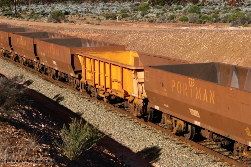 060528 4614
WOB type iron ore waggon WOB 31395 is one of a batch of twenty five built by Comeng WA between 1974 and 1975 and converted from Mt Newman high sided waggons by WAGR Midland Workshops with a capacity of 67 tons with fleet number 325 for Koolyanobbing iron ore operations. This waggon was also converted to a WSM type ballast hopper by re-fitting the cut down top section and having bottom discharge doors fitted, converted back to WOB in 1997, and this is the first one to be repainted in ARG yellow and stands out against the newer style WOE type waggons as this empty train runs past the 628 km west of Bonnie Vale, May 28, 2006.
Keywords: WOB-type;WOB31395;Comeng-WA;WSM-type;Mt-Newman-Mining;