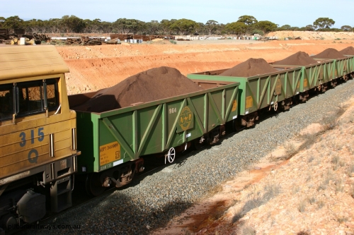 060531 5020
West Kalgoorlie, AOPY 34096 with fleet number 964 and of the drop floor type, one of seventy ex ANR coal waggons rebuilt from AOKF type by Bluebird Engineering SA in service with ARG on Koolyanobbing iron ore trains. They used to be three metres longer and originally built by Metropolitan Cammell Britain as GB type in 1952-55, May 31, 2006
Keywords: AOPY-type;AOPY34096;Bluebird-Engineering-SA;Metropolitan-Cammell-Britain;GB-type;