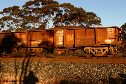 070530 9591
WOB type iron ore waggon WOB 31400 is one of a batch of twenty five built by Comeng WA between 1974 and 1975 and converted from Mt Newman high sided waggons by WAGR Midland Workshops with a capacity of 67 tons with fleet number 324 for Koolyanobbing iron ore operations, but purchased by WAGR. This waggon is one of the 15 converted to WSM type ballast hoppers by re-fitting the removed top section of the body and fitting bottom discharge doors, converted back to WOB in 1998. The angled lines from this conversion are still visible. Loaded train at Binduli, May 30, 2007.
Keywords: WOB-type;WOB31400;Comeng-WA;WSM-type;Mt-Newman-Mining;