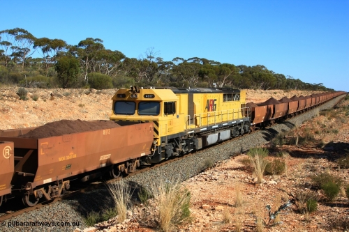 100602 8570
WOE type iron ore waggon WOE 33414 is one of a batch of one hundred and forty one built by United Group Rail WA between November 2005 and April 2006 with serial number 950142-119 and fleet number 8913 for Koolyanobbing iron ore operations, the 8 being a addition due to fleet size, and a build date of 04/2006 with a revised load of 82.5 tonnes with PORTMAN painted out, seen here with mid-train DPU locomotive Q 4017 and train out over the grade, west of Binduli, June 2, 2010.
Keywords: WOE-type;WOE33414;United-Group-Rail-WA;950142-119;
