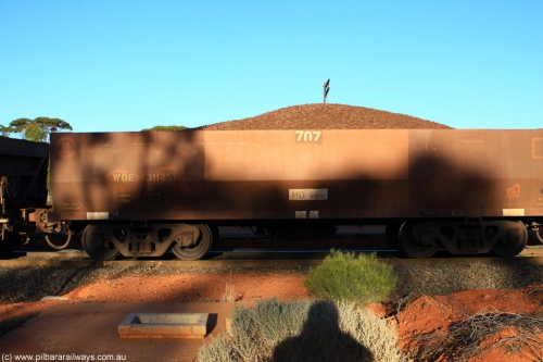 100731 02283
WOE type iron ore waggon WOE 31125 is one of a batch of one hundred and thirty built by Goninan WA between March and August 2001 with serial number 950092-115 and fleet number 707 for Koolyanobbing iron ore operations, on loaded train 6413 at Binduli Triangle, July 31, 2010.
Keywords: WOE-type;WOE31125;Goninan-WA;950092-115;