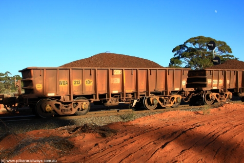100731 02351
WOA type iron ore waggon WOA 31310 is one of a batch of thirty nine built by WAGR Midland Workshops between 1970 and 1971 with fleet number 206 for Koolyanobbing iron ore operations, with a 75 ton and 1018 ft³ capacity, on loaded train 6413 at Binduli Triangle, 31st July 2010.
Keywords: WOA-type;WOA31310;WAGR-Midland-WS;