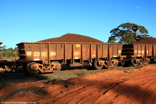 100731 02352
WO type iron ore waggon WO 31204 is one of a batch of eighty six built by WAGR Midland Workshops between 1967 and March 1968 with fleet number 101 for Koolyanobbing iron ore operations with a 75 ton and 1018 ft.³ capacity, on loaded train 6413 at Binduli Triangle, July 31, 2010. This unit was converted to WOS superphosphate in the late 1980s till 1994 when it was re-classed back to WO.
Keywords: WO-type;WO31204;WAGR-Midland-WS;WOS-type;