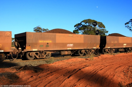 100731 02392
WOE type iron ore waggon WOE 31099 is one of a batch of one hundred and thirty built by Goninan WA between March and August 2001 with serial number 950092-089 and fleet number 684 for Koolyanobbing iron ore operations, on loaded train 6413 at Binduli Triangle, 31st July 2010.
Keywords: WOE-type;WOE31099;Goninan-WA;950092-089;