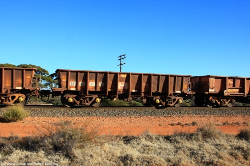 100731 02423
WO type iron ore waggon WO 31222 is one of a batch of eighty six built by WAGR Midland Workshops between 1967 and March 1968 with fleet number 117 for Koolyanobbing iron ore operations, with a 75 ton and 1018 ft³ capacity, on empty train 6418 at Binduli Triangle, July 31, 2010. This unit was converted to WOG for gypsum in late 1980s till 1994 when it was re-classed back to WO.
Keywords: WO-type;WO31222;WAGR-Midland-WS;