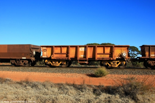 100731 02426
WOB type iron ore waggon WOB 31395 is one of a batch of twenty five built by Comeng WA between 1974 and 1975 and converted from Mt Newman high sided waggons by WAGR Midland Workshops with a capacity of 67 tons with fleet number 325 for Koolyanobbing iron ore operations. This waggon was also converted to a WSM type ballast hopper by re-fitting the cut down top section and having bottom discharge doors fitted, converted back to WOB in 1997, on empty train 6418 at Binduli Triangle, July 31, 2010.
Keywords: WOB-type;WOB31395;Comeng-WA;WSM-type;Mt-Newman-Mining;
