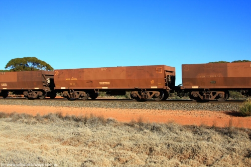 100731 02506
WOE type iron ore waggon WOE 33303 is one of a batch of one hundred and forty one built by United Goninan WA between November 2005 and April 2006 with serial number 950142-008 and fleet number 802 for Koolyanobbing iron ore operations, on empty train 6418 at Binduli Triangle, July 31, 2010.
Keywords: WOE-type;WOE33303;United-Goninan-WA;950142-008;